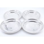 Four late Victorian silver plates, having a stepped rim and a reeded edge, one having double