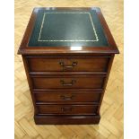 A late 20th Century mahogany two-drawer filing cabinet, having an inset gilt-tooled leather top,