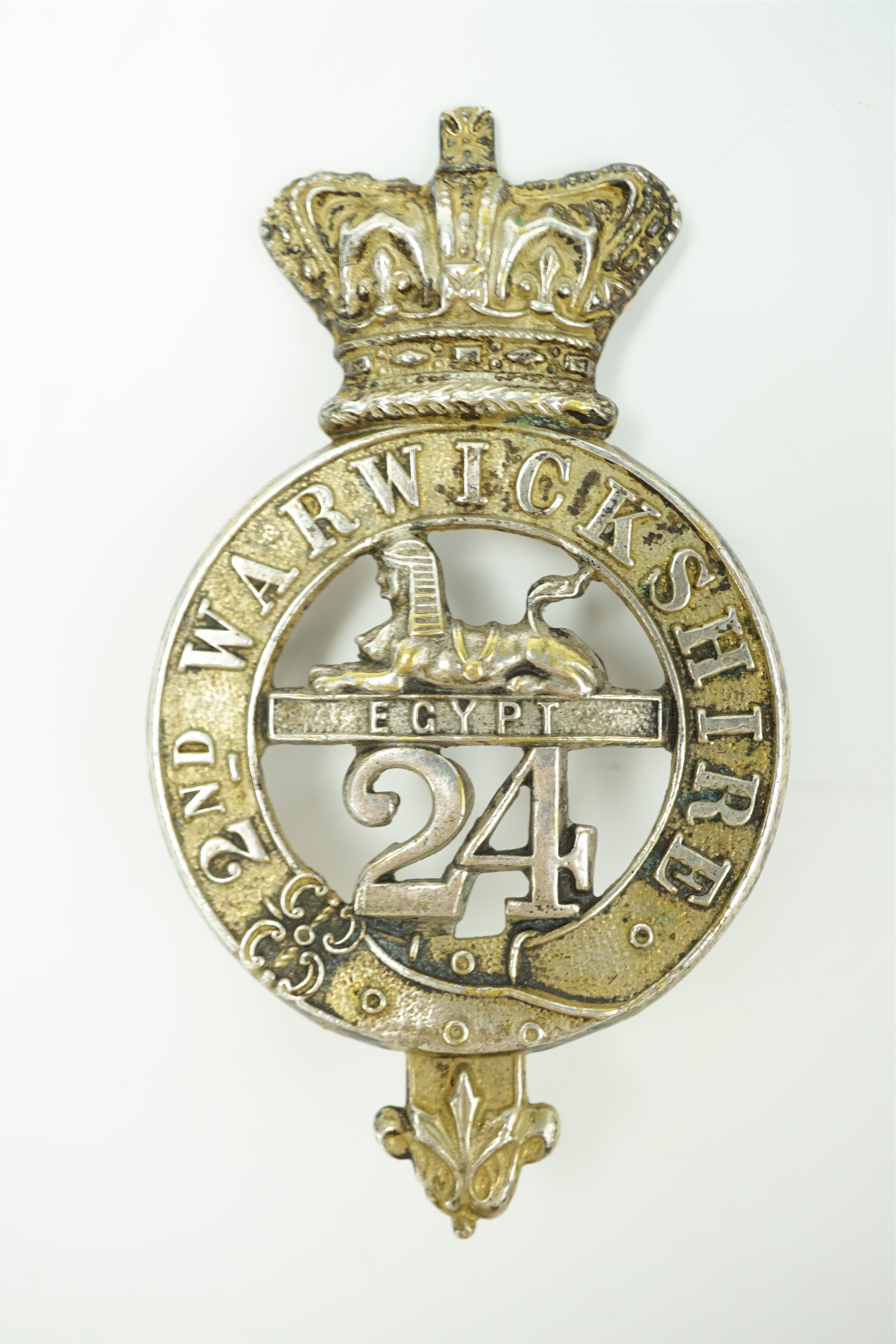 A 24th (2nd Warwickshire) Regiment of Foot glengarry badge, circa 1874-81. [A company of the 2nd