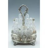 A Victorian cut glass cruet set, in an electroplate stand, 28 cm