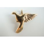 A contemporary 9 ct gold pendant in the form of a dove in flight, 22 mm, 1.7 g