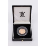 A 1998 Royal Mint cased gold proof commemorative fifty pence coin, celebrating the fiftieth