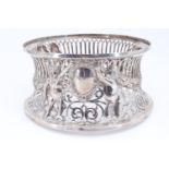 An early 20th Century Irish silver dish ring, having repousse decoration of children holding