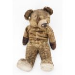 An early Chad Valley Teddy bear, having a growler and a glass eye, 50 cm (a/f)