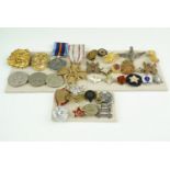 Sundry items of world military and other insignia and medals