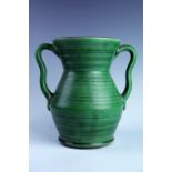 Schofield Pottery, Wetheriggs, Penrith, Cumberland, a large two-handled green slipware vase, of