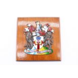 An enamelled electroplate armorial of Lloyd's Register of Shipping, mounted on a mahogany plaque, 15