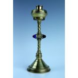 A Victorian gothic revival ecclesiastical brass candle stick, its stem having a collar with