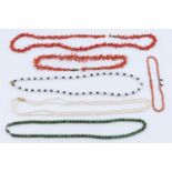 five mid to late 20th Century necklaces, comprising two cultured pearl, two coral and jadeite,