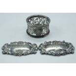 A Victorian silver napkin ring, together with two electroplate bottle tickets, silver 26 g