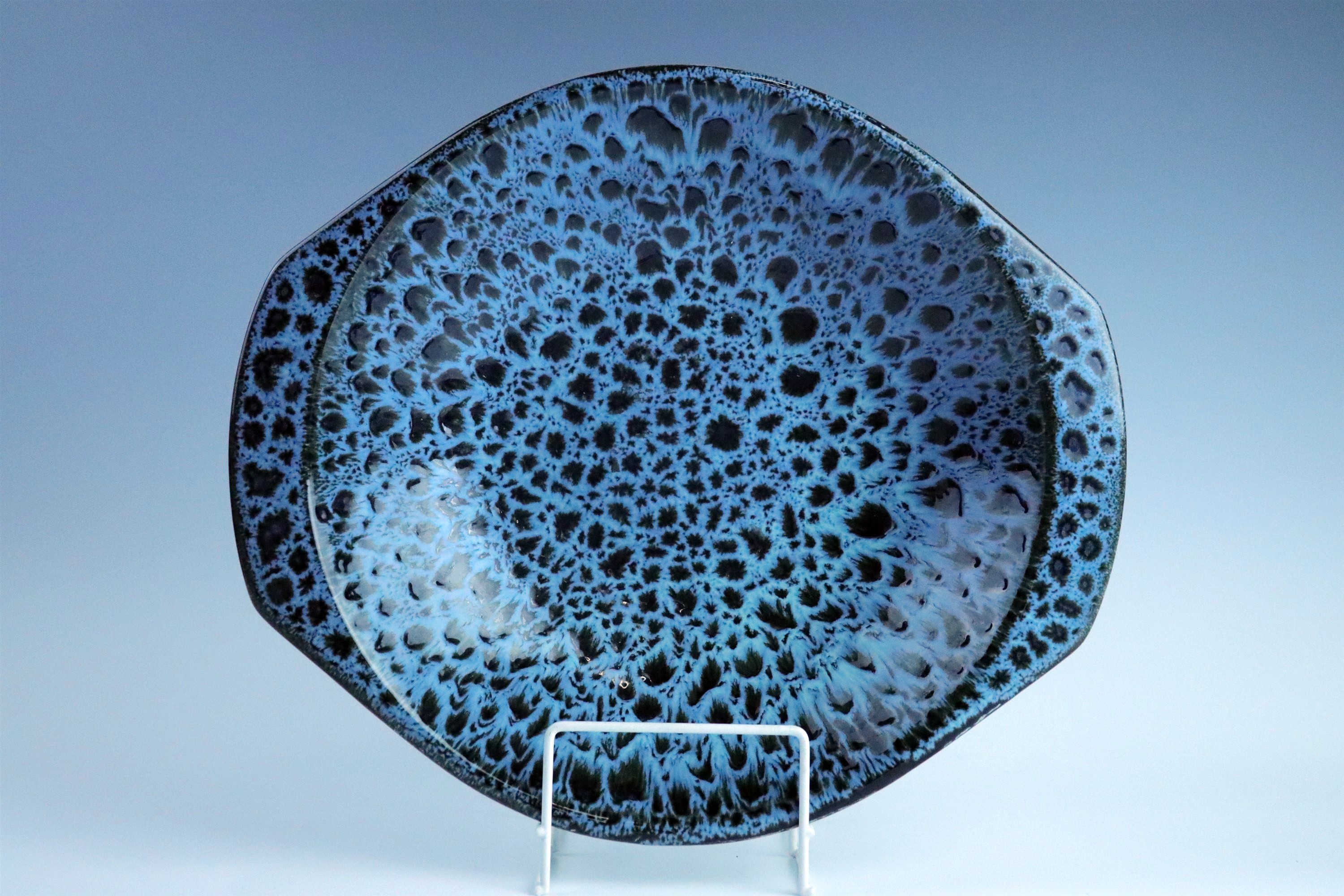 A Poole Pottery mottled blue / black glazed fruit bowl, 35 cm