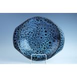 A Poole Pottery mottled blue / black glazed fruit bowl, 35 cm