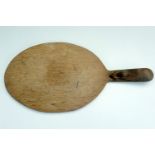Mouseman Thompson of Kilburn A carved oak cheese board, 37.5 x 18 cm