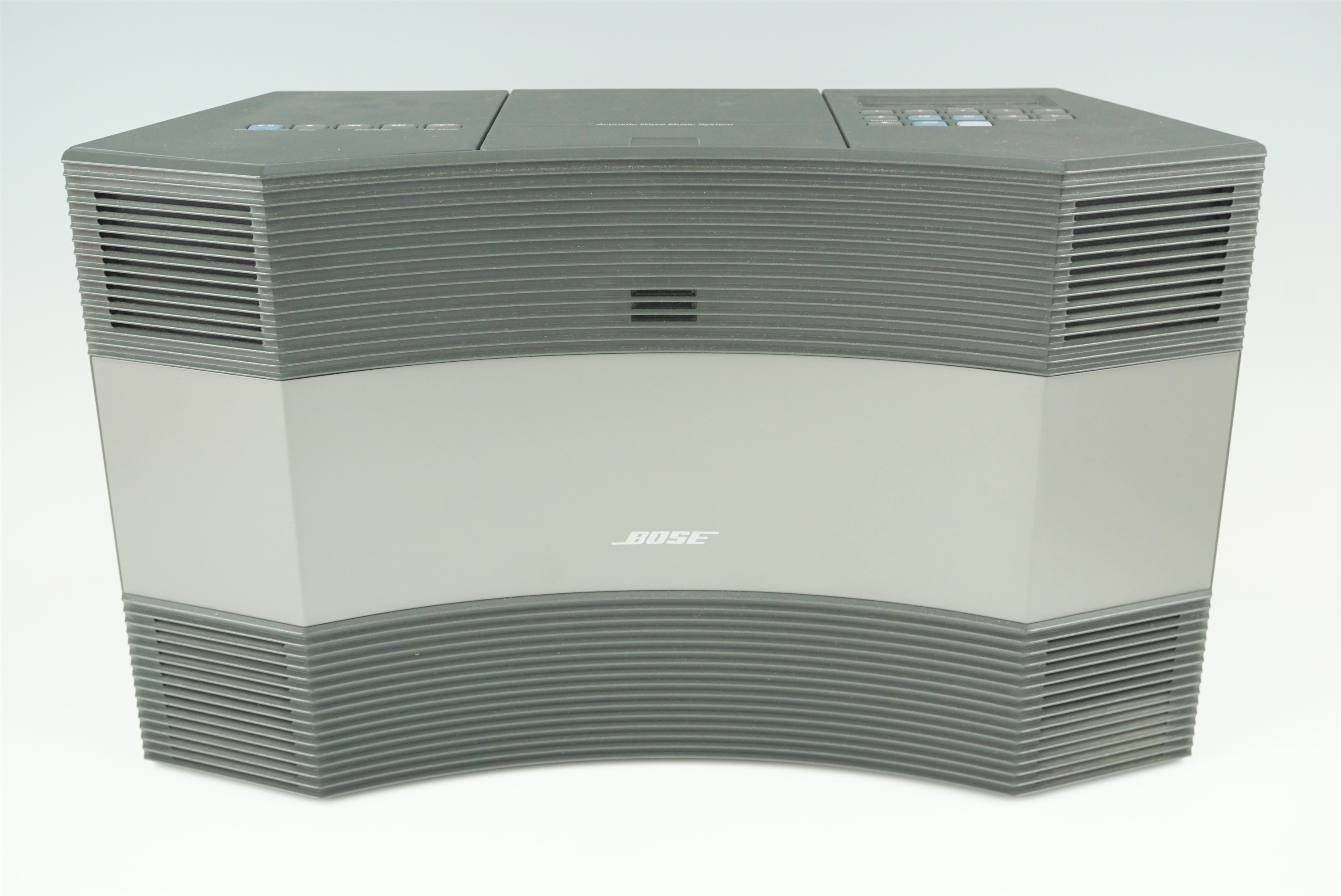 A Bose "Acoustic Wave" radio and CD player, with remote control and instructions