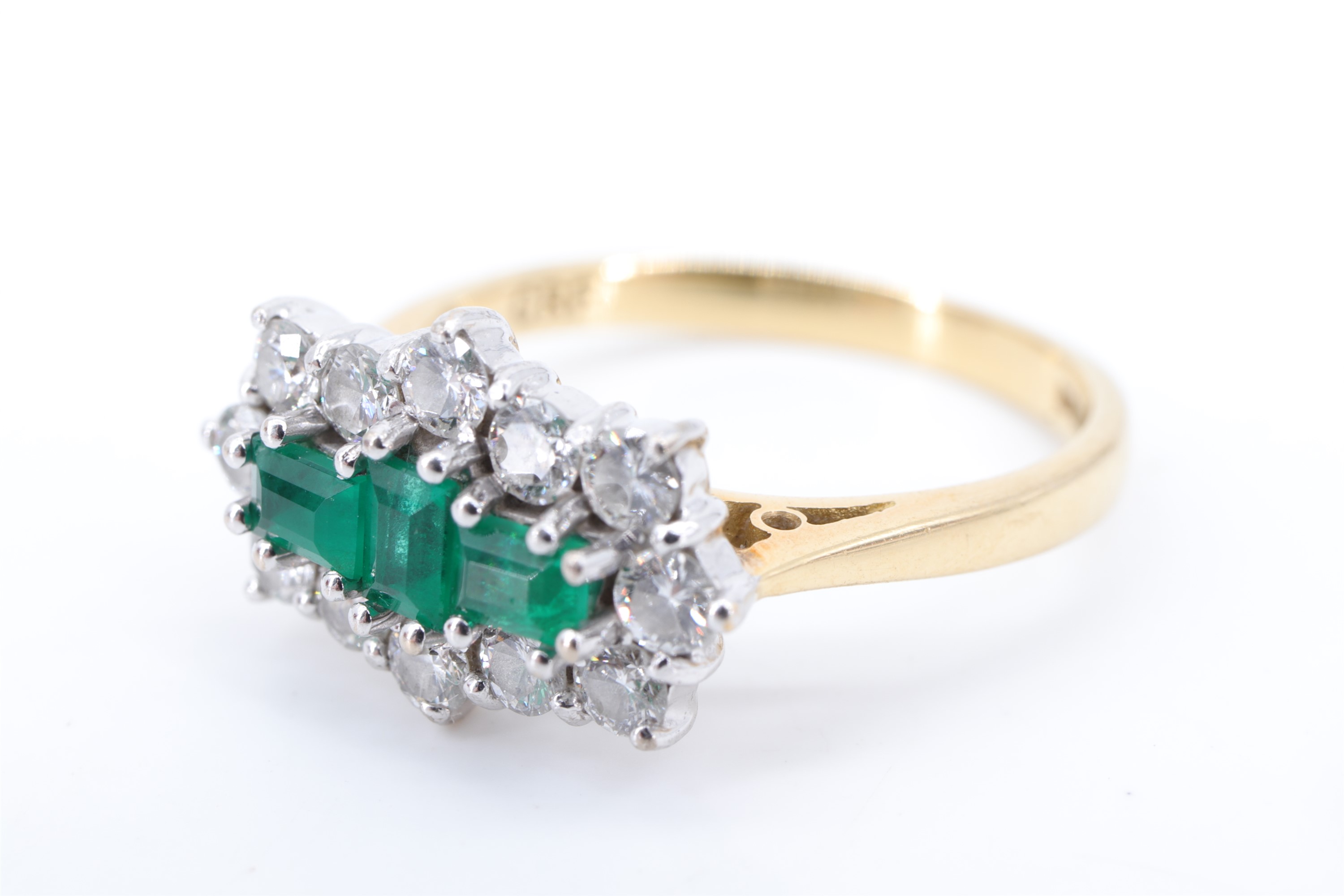 A fine emerald and diamond ring, comprising a pair of baguette-cut emeralds divided by one other set - Image 3 of 6