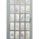 A framed group of vintage cigarette cards depicting Great War British and Empire subjects, in gilt