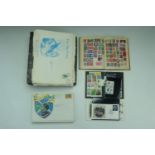 A binder of largely 20th Century world stamps together with a mid-20th Century juvenile stamp album,