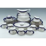 A quantity of Royal Worcester Regency pattern blue and gilt dinner ware