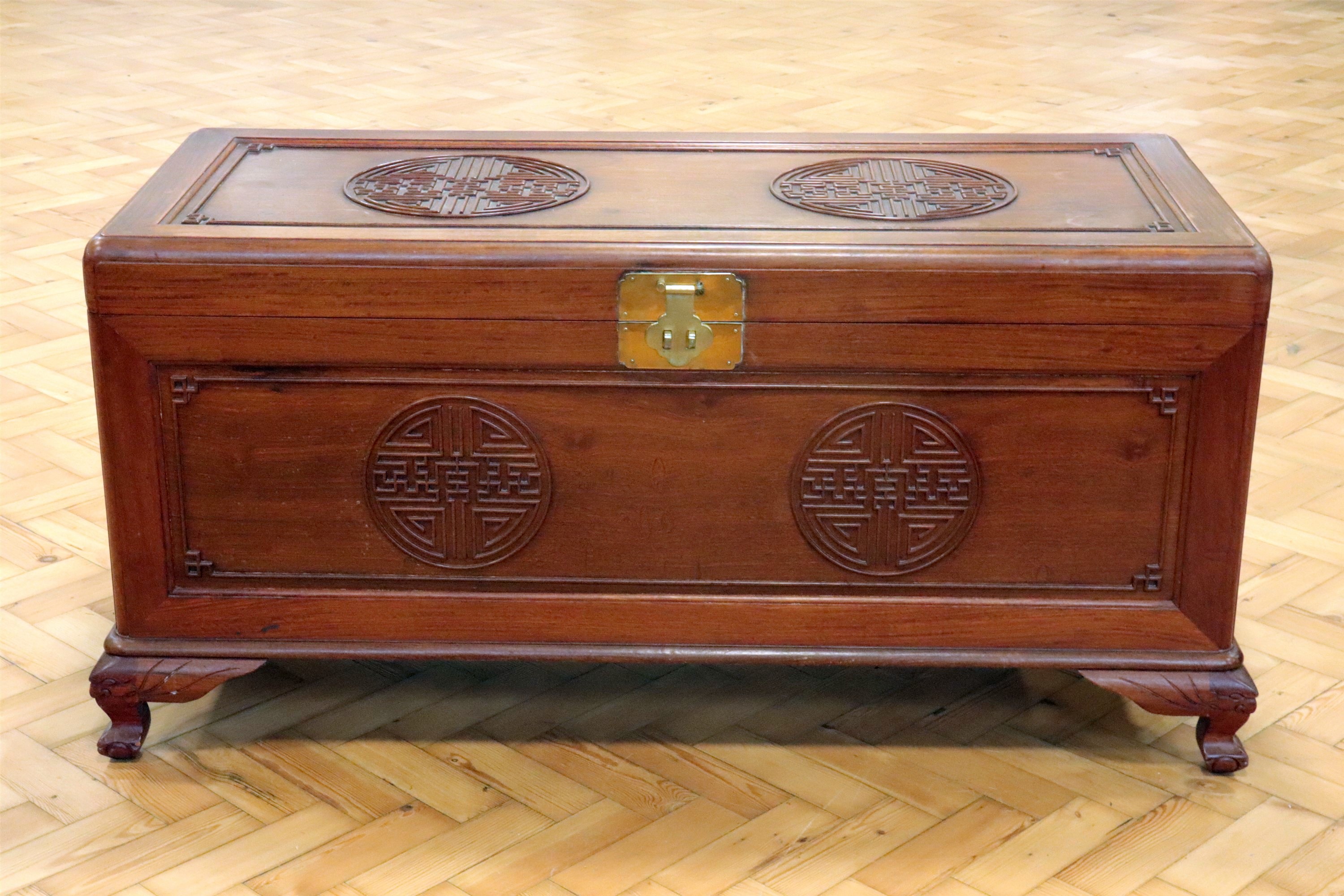 A mid-to-late 20th Century Chinese carved camphor wood chest, 123 cm x 53 cm x 60 cm high