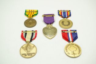 A group of US medals including a Purple Heart and a Marine Corps Expeditionary medal