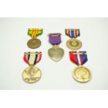 A group of US medals including a Purple Heart and a Marine Corps Expeditionary medal