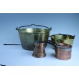 A group of kitchenalia, comprising two brass jam pans, a WMF warming pan, a 19th Century copper