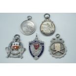 Three 1930s silver target shooting fob medals, a white metal medal, and two enamelled electroplate