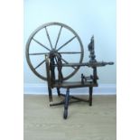 A 20th Century reproduction stained sycamore spinning wheel, 98 cm x 94 cm