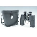 A cased pair of Chinon 10 x 50 5.5 degree field binoculars