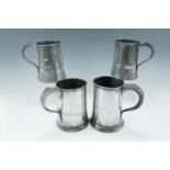 Four 19th Century pewter quart mugs