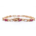 A modern ruby and white garnet yellow metal bracelet, comprising eight oval rubies and eight oval