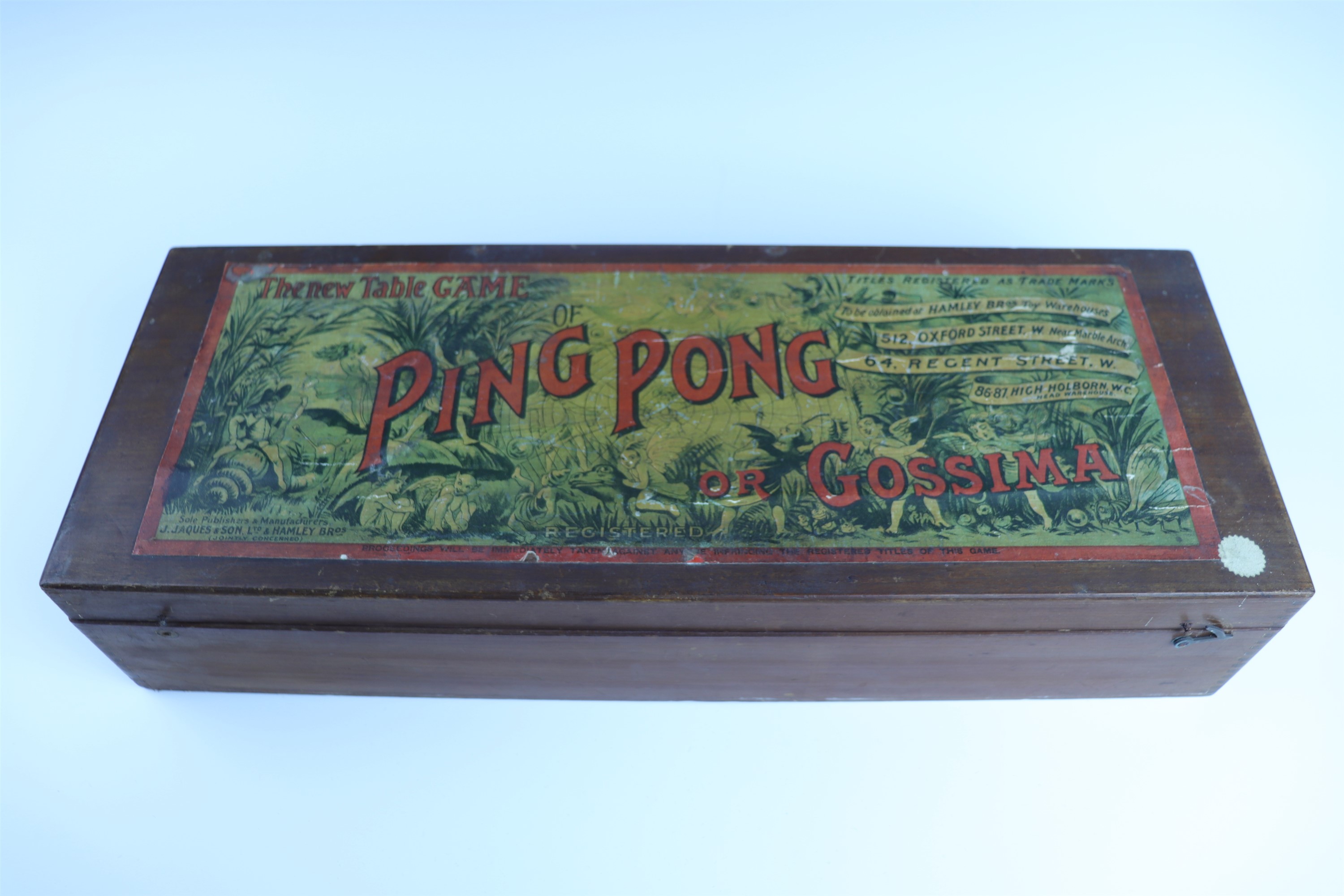 An early 20th Century J Jacques cased Ping Pong (or Gossing) table top parlour game, in