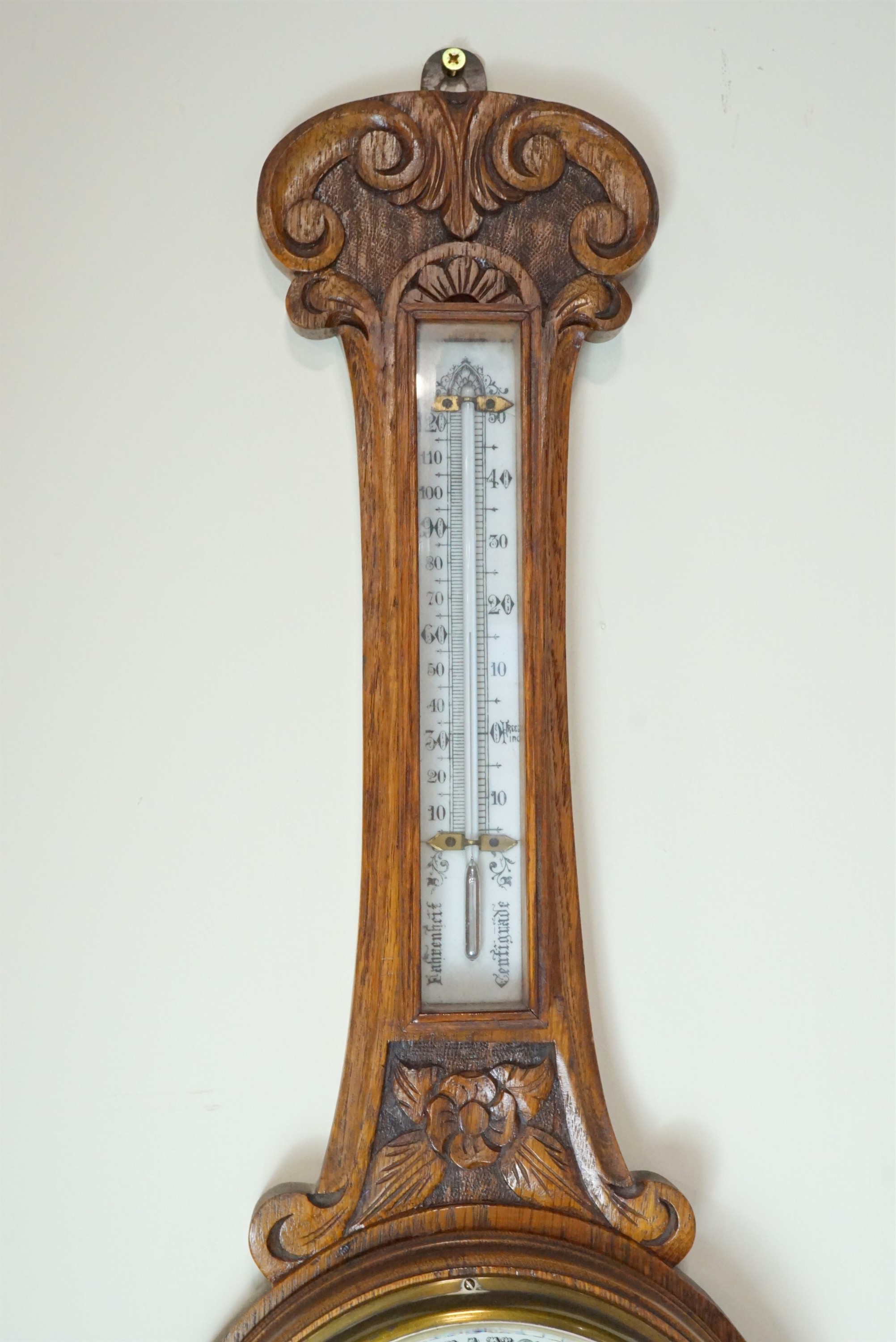 A late 19th / early 20th Century carved oak banjo aneroid barometer, 85 cm - Image 3 of 3