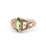 A demantoid ring, comprising a marquise cut gemstone of approx 1 ct chevron bar set on a