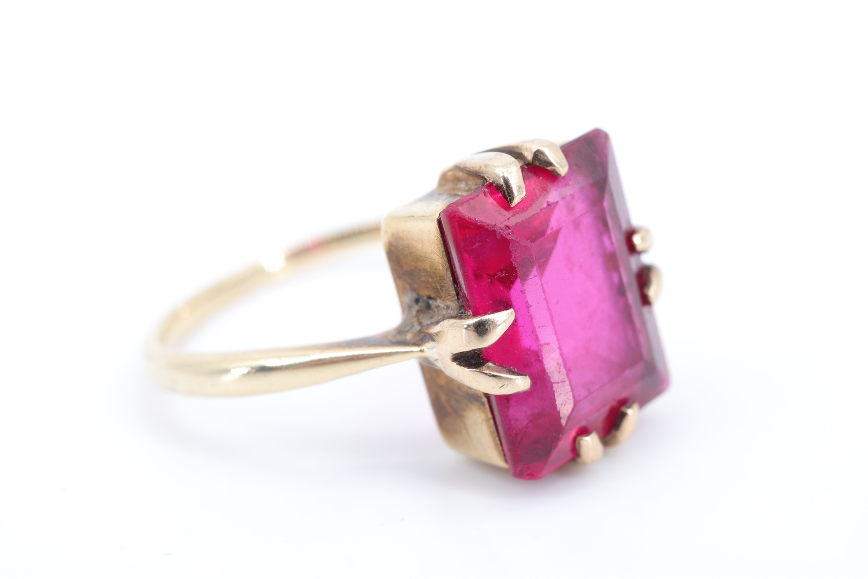 A vintage ruby cocktail ring, the baguette-cut stone of approx 4 ct, claw-set on a rectangular - Image 2 of 4