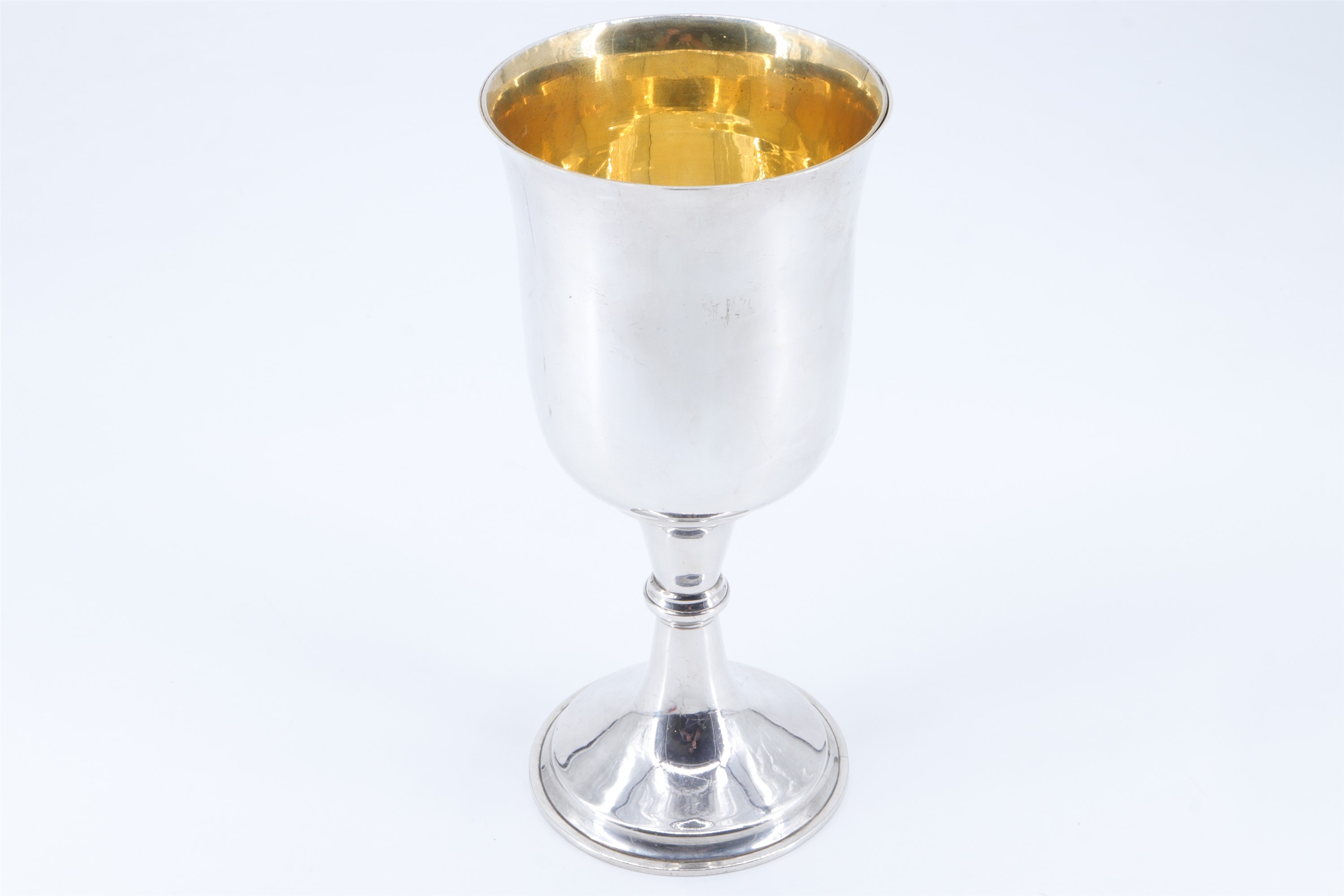 A late Victorian silver chalice, of plain form with a flared pedestal base and a central knop,