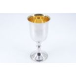 A late Victorian silver chalice, of plain form with a flared pedestal base and a central knop,