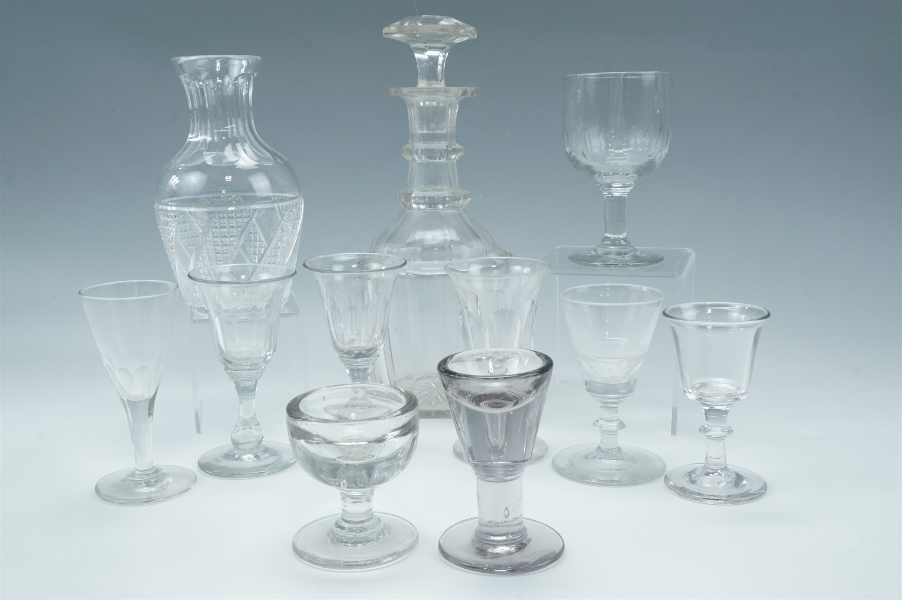A William IV cut glass wine decanter together with a cut glass carafe and sundry 19th Century wine