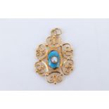 An artisan-made openwork yellow metal pendant, comprising a central oval blue iridescent enamel