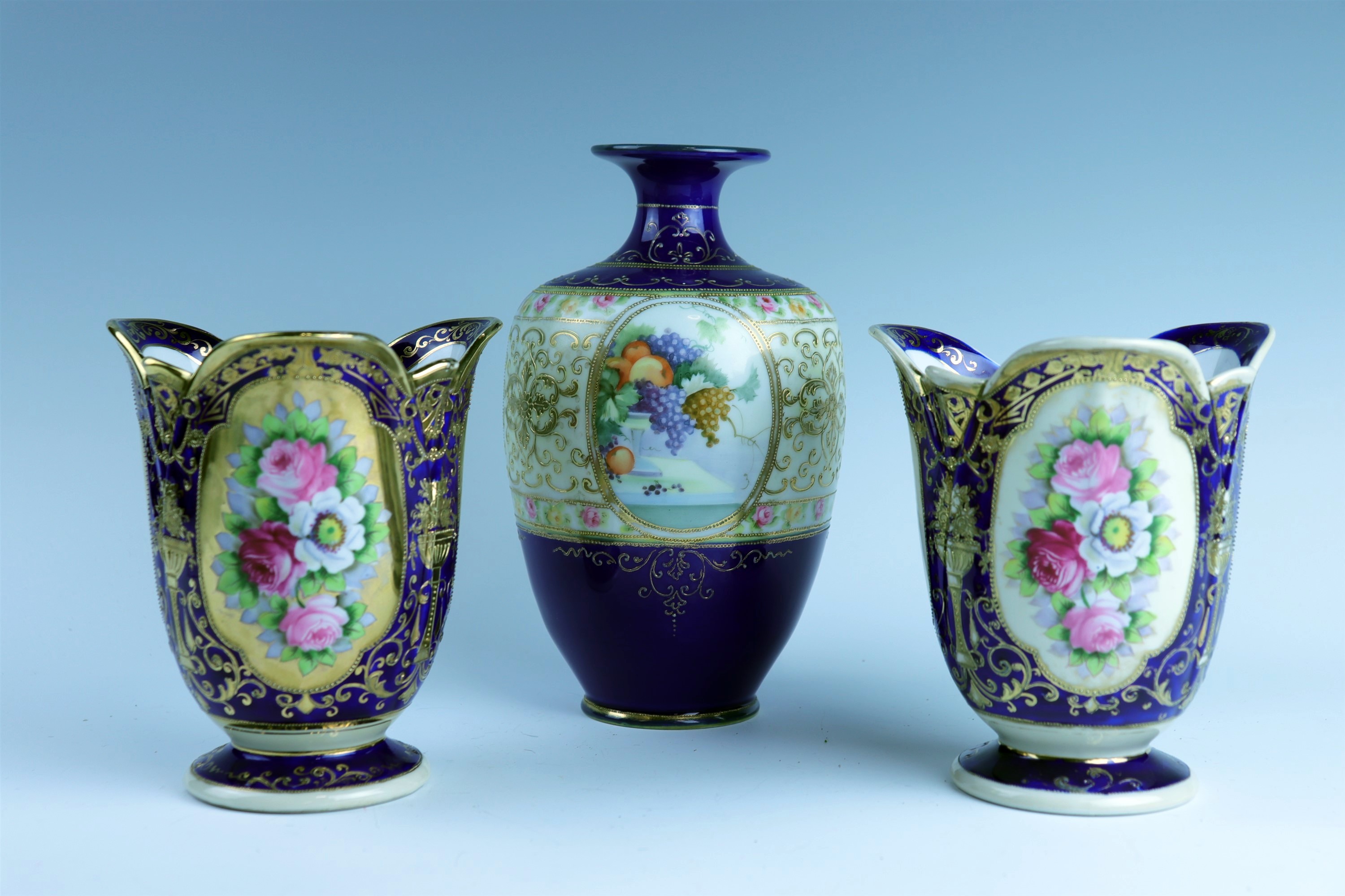 A pair of Noritake vases together with a similar ovoid vase, circa 1930s, tallest 23 cm