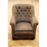 A late 19th / early 20th Century button-upholstered lounge armchair, 84 cm high x 82 cm wide