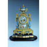 A French Belle Epoque gilt metal garniture mantle clock, incorporating Sevres style porcelain,
