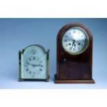 Two early 20th Century dome top mantle clocks, comprising a brass clock, having a French drum