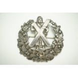 A Victorian Queen's Own Highlanders officer's white metal glengarry badge, stamped "Sterling" and