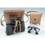 A cased pair of Prinz 8x30 binocular field glasses, together with a cased pair of Perl 8 x 20