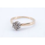 A seven stone diamond flowerhead cluster ring, the brilliants of approx 0.25 ct aggregate weight
