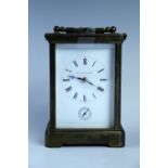 A late 20th Century Matthew Norman carriage alarm clock, 14 cm excluding handle, (running when