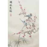 A Chinese embroidered silk study of exotic birds amongst blossoming prunus and bamboo, red seal