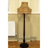 A 1930s - 1940s mahogany standard lamp