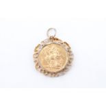 An 1880 young head Victoria Sovereign in a 9 ct gold openwork pendant frame, 10.59 g, 38 mm